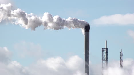 Pollution-billows-out-from-chimneys-at-a-chemical-plant-on-windy-day