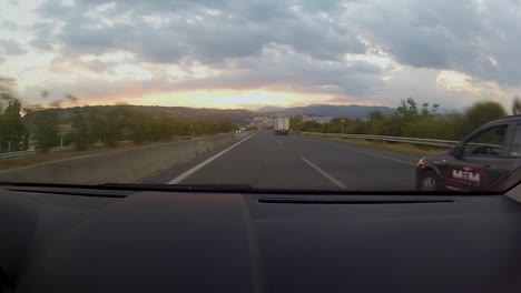 Beautiful-sunset-and-mountain-line,-while-driving-on-the-autobahn-between-Thessaloniki-and-Ioannina-in-the-northwest-region-of-Greece-through-the-Pindos-mountains