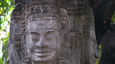 Slider-Shot-Showing-Khmer-Stone-Face-Carvings-Near-Angkor-Wat