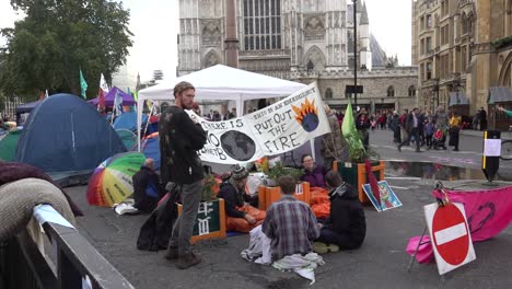 protesters-sit-on-the-floor-during-the-Extinction-Rebellion-protests-in-London,-UK