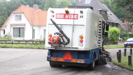 Street-sweeper-at-work-in-suburban-neighbourhood-in-the-Netherlands