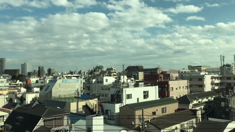 A-view-from-the-bullet-train-heading-to-Osaka,-Japan