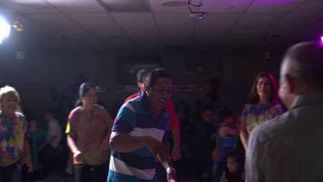 Parallax-shot-of-adult-Filipino-and-Asian-people-dancing-at-a-party-gathering-in-4K