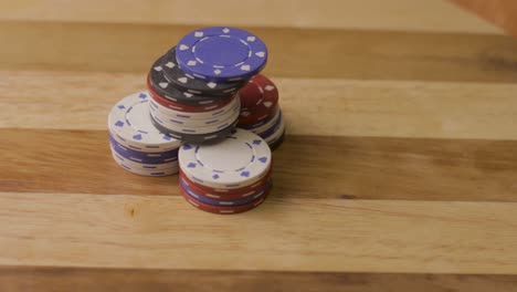 static-close-up-of-playing-cards-thrown-down-on-stack-of-poker-chips