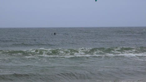 Two-men-kite-surfing-during-winter-on-Baltic-sea
