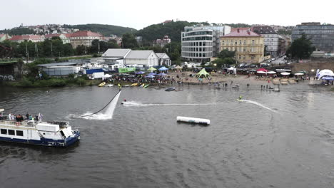 Aerial-Shot-Of-Surfers-Performing-Stunts-At-A-Jetsurf-Competition-In-Prague,-Extreme-Summer-Sports