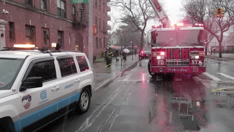 Fire-Engine-ladder-and-ConEd-vehicle-on-the-scene-of-snowy-Power-Cable-accident---Wide-shot