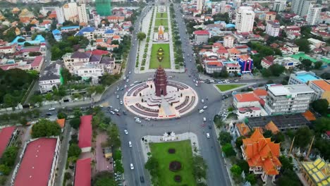Aerial-top-down-shot-of-famous-Independence-Monument-and-cars-driving-in-roundabout-during-daylight