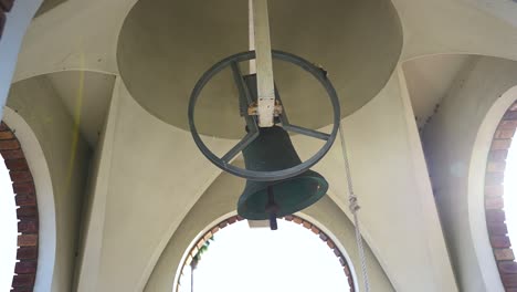 Large-Bell-Ringing-in-slow-motion-in-tower,-Close-shot