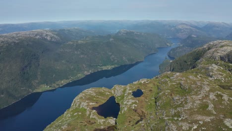 Flying-above-Norwegian-fjord-Veafjorden-and-over-the-Mountains