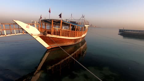 A-view-traditional-wooden-boat-in-Qatar-is-known-as-Dhow,-it-offers-ride-to-passengers-for-5$-per-person-at-Corniche-in-Doha,-Qatar
