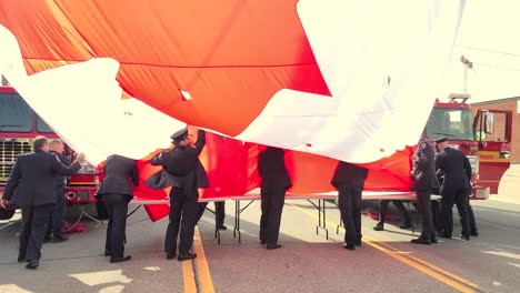 Toronto,-Ontario,-Canada---09-21-2022:-Flag-folding-during-the-funeral-tribute-to-police-officer-Andrew-Hong,-murdered-at-Tim-Hortons