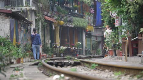 Daily-life-on-Train-Street-with-locals-in-famous-Old-Quarter-in-Hanoi,-Vietnam