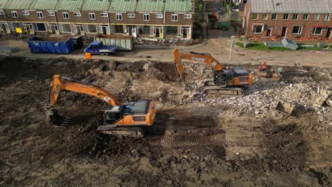 Excavators-At-Work-At-The-Demolition-Site-Of-Village-Houses-In-The-Netherlands