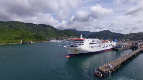 A-shot-of-an-Interislander-ferry-docked-with-Picton-in-the-background,-New-Zealand