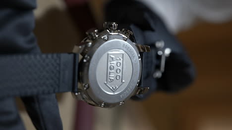Macro-vertical-close-up-shot-of-Luxury-Chopard-1000-miglia-watch,-rear-view