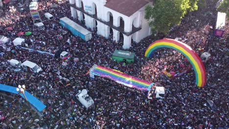 Multitude-of-people-in-crowdy-Plaza-de-Mayo-for-march-of-LGBT-Pride-Parade,-Buenos-Aires-in-Argentina