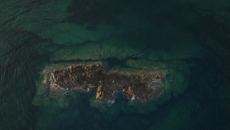 Sea-stack-rock-island-turquoise-Menorca-Spain-Balearic-island-aerial