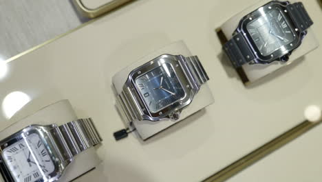 Top-view-vertical-shot-of-Cartier-watches-on-display
