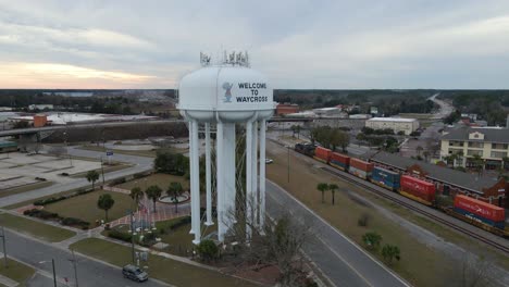 Water-tower-in-Waycross-Georgia-at-Sunset-Aerial-View-Tracking-Right