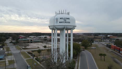 Watertower-in-Waycross-Georgia-at-Sunset-Aerial-View-Tracking-Left