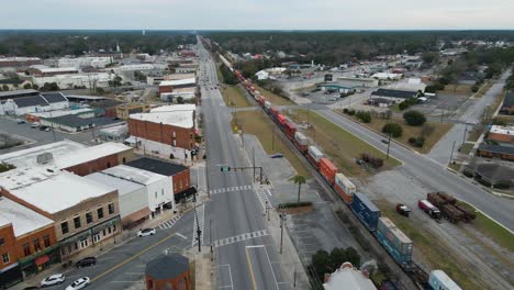 Waycross-Georgia-and-Train-Stopped-at-Station-Aerial-View-Tracking-Right