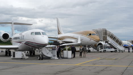 Large-business-jets-shown-at-aviation-convention,-trade-show,-Geneva,-tripod