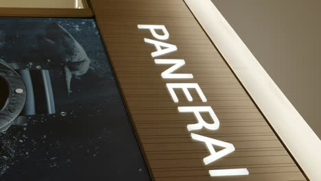 Panerai-luxury-watch-logo,-establisher-vertical-close-up-shot,-pan-left,-interior-mall