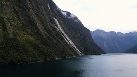Picturesque-Milford-Sound-fjord,-New-Zealand-with-slope-devastated-by-massive-landslide