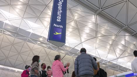 Flight-passengers-go-through-the-departure-hall-at-Hong-Kong's-Chek-Lap-Kok-International-Airport