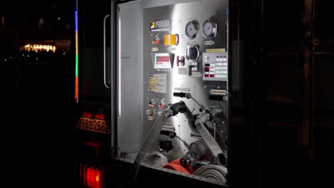 Korean-Fire-Truck-Control-Panel-with-Connected-Fire-Hoses-at-night-in-Seoul-Fire-Scene---tilt-down
