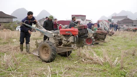 Farmers-are-harvesting-the-land-as-a-ritual-of-the-cultural-activities-in-the-Long-Tong-festival,-held-in-Bac-Son-town,-Lang-Son-province,-Vietnam