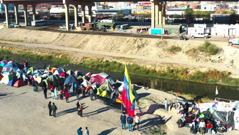 A-Venezuelan-flag-flutters-in-the-wind-at-a-migrant-camp-on-the-Texas-Chihuahua-border