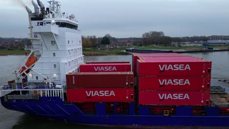 Aerial-View-Off-Starboard-Energy-Cargo-Ship-Carrying-Viasea-Intermodel-Containers-Passing-Along-Oude-Maas