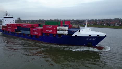 Aerial-View-Off-Starboard-Energy-Cargo-Ship-Carrying-Viasea-Intermodel-Containers-Along-Oude-Maas