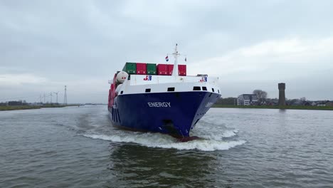 Aerial-Flying-Close-Around-Forward-Bow-Of-Energy-Cargo-Ship-Carrying-Viasea-Intermodal-Containers-Sailing-Along-Oude-Maas