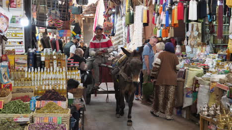 Donkey-cart-with-driver-cruise-through-marketplace-in-Marrakesh,-Morocco