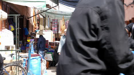 Marrakech-street-view,-market,-people-walking-by