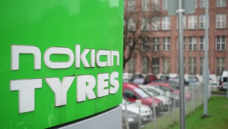 Nokian-Tyres,-Nokian-renkaat,-sign-in-front-of-their-tire-factory-in-Nokia,-Finland