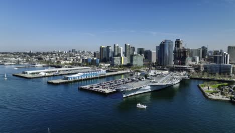 Aerial-view-of-the-USS-Midway-Museum-at-the-Navy-pier-in-sunny-San-Diego,-USA