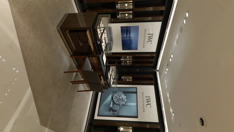 VERTICAL-Luxurious-watch-shop-interior,-IWC-Schaffhausen-elegant-brand-customer-sales-counter