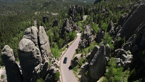 Aerial-View-of-Road-Between-Scenic-Rock-Formations-of-Black-Hills,-Custer-State-Park,-South-Dakota-USA
