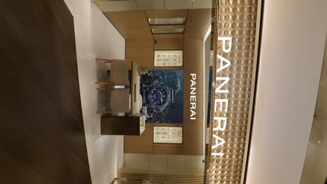 Vertical-zoom-in-shot-of-Panerai-luxury-watch-shop-in-mall