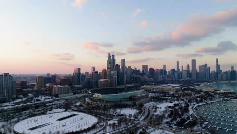 Aerial-view-around-the-Solider-field-stadium,-snowy-evening-in-Chicago,-USA---wide,-panoramic-drone-shot