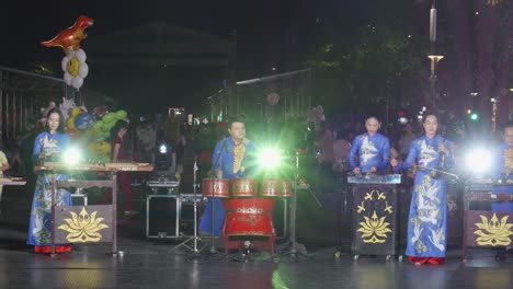 Traditional-Vietnamese-folk-music-group-performs-on-stage-in-Ho-Chi-Minh-city-at-night