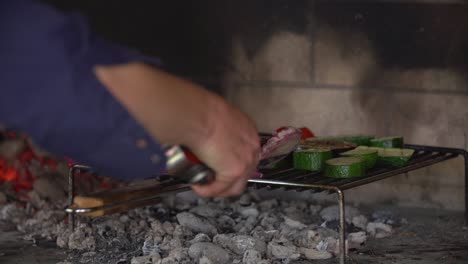 Cooking-turning-vegtables-cucumbers-and-onions-on-barbacue