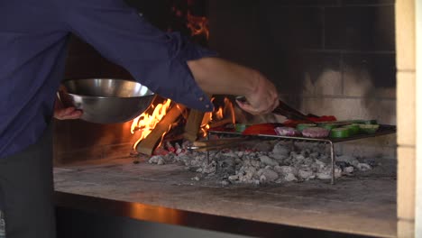 Cooking-taking-vegetables-from-barbacue