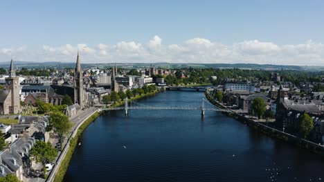 Wide-aerial-view-of-the-River-Ness-running-through-Inverness,-Scotland's-downtown-area