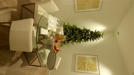 Vertical-video-of-Christmas-tree-on-living-room-with-champagne-bottle-on-table