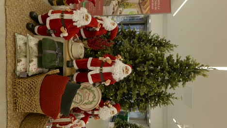 Vertical-video-of-Christmas-shopping-mall-decorations-with-Santa-and-xmas-tree